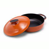 Orange enameled cast iron braiser by BUCHYMIX NIGERIA, 5-quart size, showcasing a smooth, glossy finish and sturdy handle.