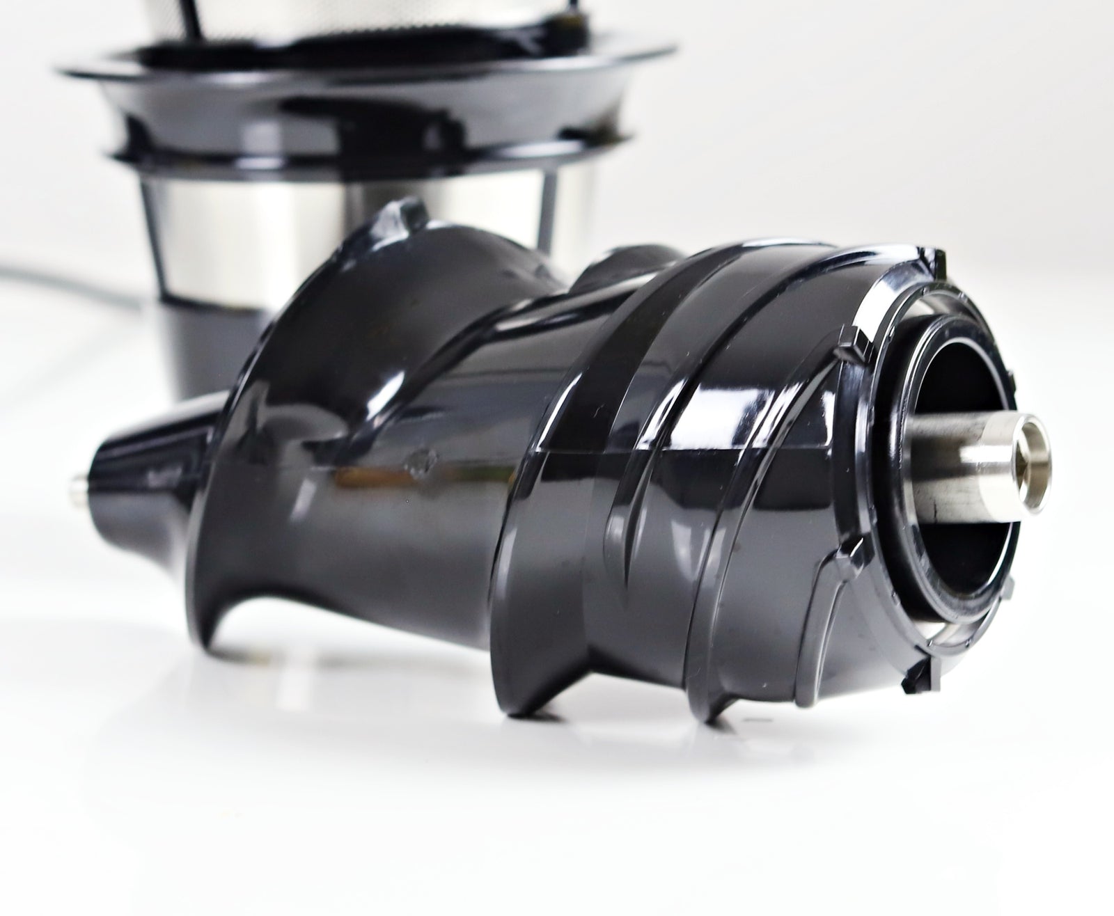 Juicer auger outlet